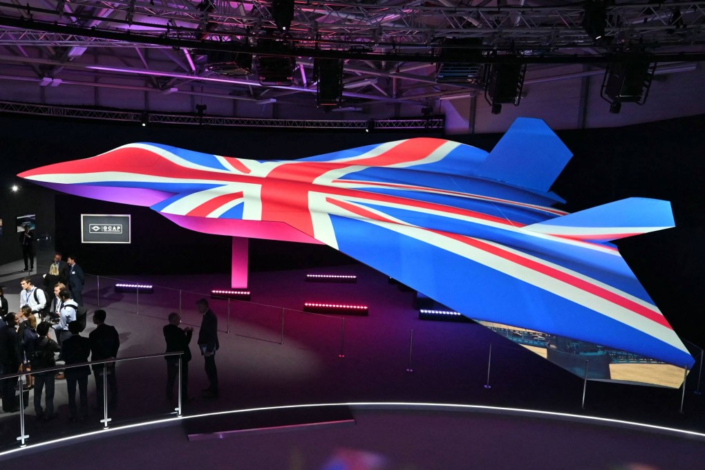 Delegates look at the GCAP sixth-generation fighter jet concept design at the Farnborough International Airshow 2024. Photo: AFP