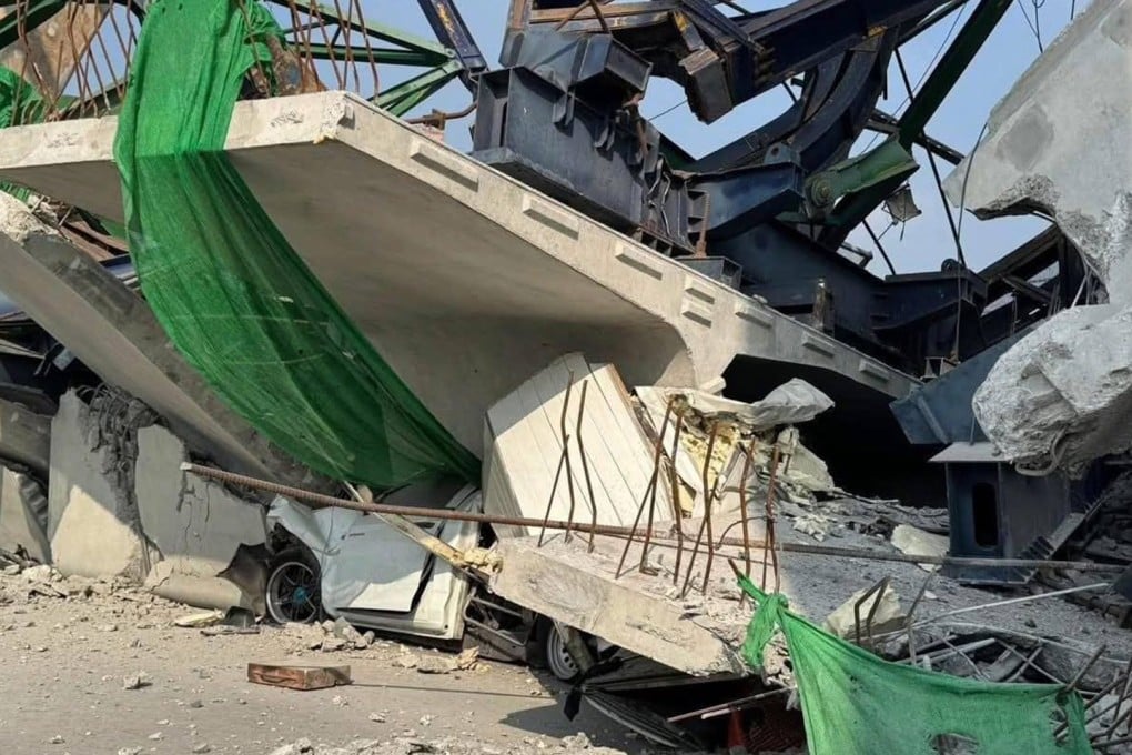 A crushed car sits among the debris after a crane collapses at the under-construction Rama II Expressway on Thursday. Photo: Xinhua