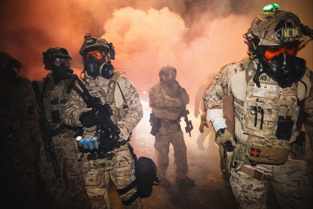 US federal agents use tear gas, pepper balls and flash bangs to secure a perimeter as protests erupted after an ICE-involved shooting in Minneapolis. Photo: dpa