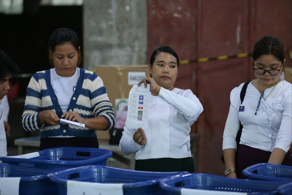 An official of the Union Election Commission displays a ballot for counting during the second phase of the general election at a polling station in Yangon, Myanmar, on Sunday. Photo: Xinhua