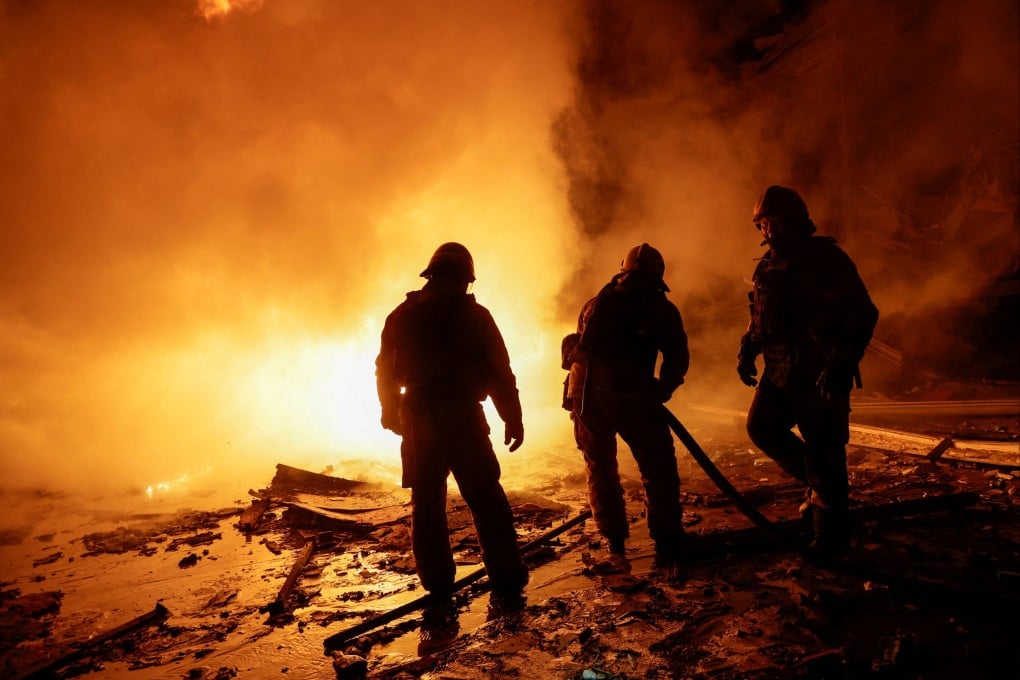 Firefighters work at a private delivery company’s logistics hub hit by a Russian missile strike in Kharkiv, Ukraine on Tuesday. Photo: Reuters