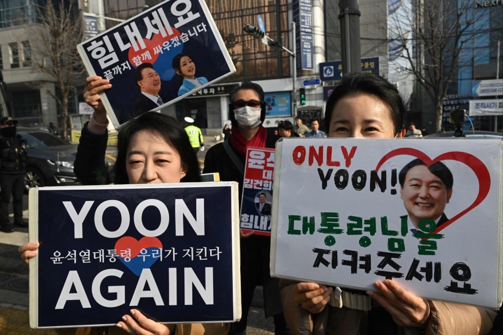 Supporters of South Korea’s former president Yoon Suk-yeol gather in front of the Seoul Central District Court on Friday. Photo: AFP