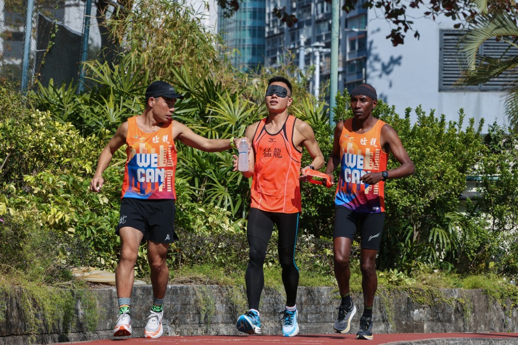 Marco Wong (centre) with guide runner Lukas Wambua Muteti (right) and deaf runner Jason Cheng. Photo: Nora Tam