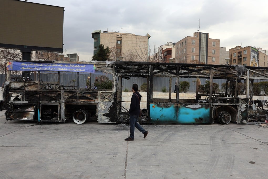 The wreckage of a burnt-out public bus in Tehran. Iran remains under a near-total nationwide internet blackout amid anti-government protests. Photo: EPA