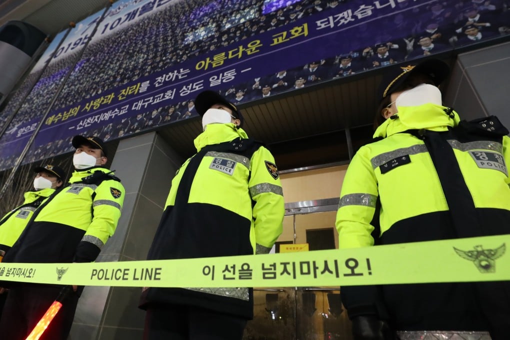 South Korean police officers bar entry to the Shincheonji Church of Jesus in Daegu after a coronavirus outbreak in 2020. Photo: Yonhap/EPA-EFE