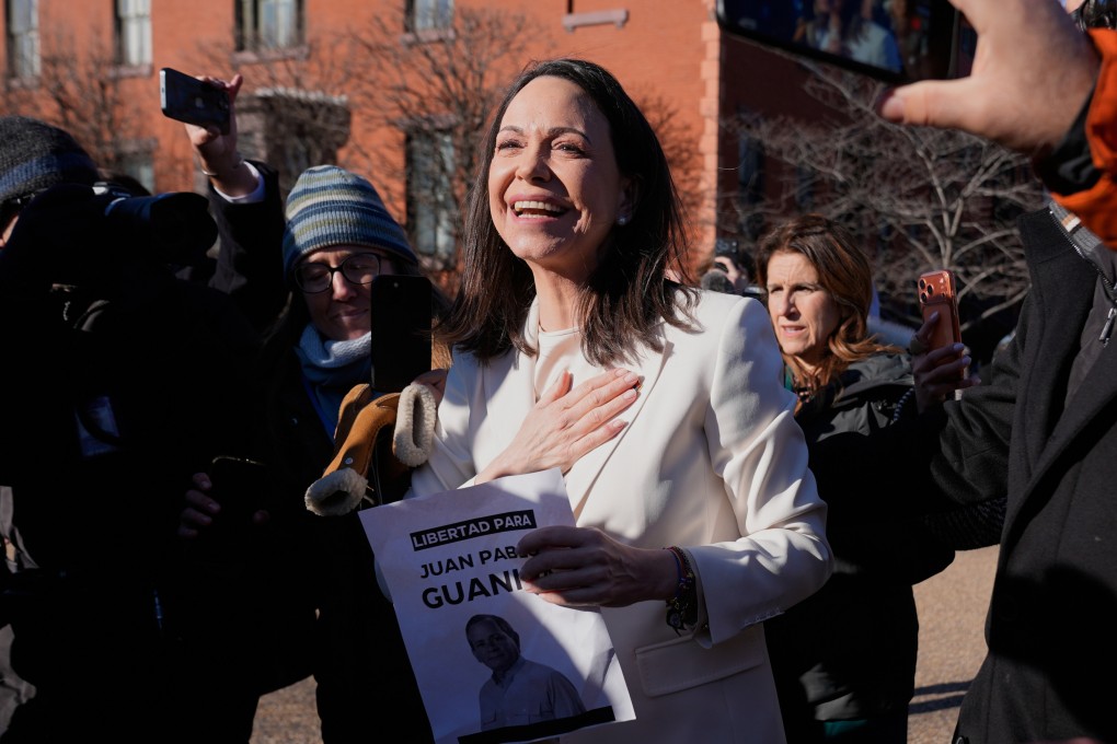 Venezuelan opposition leader Maria Corina Machado greets supporters near the White House after meeting with President Donald Trump. Photo: AP