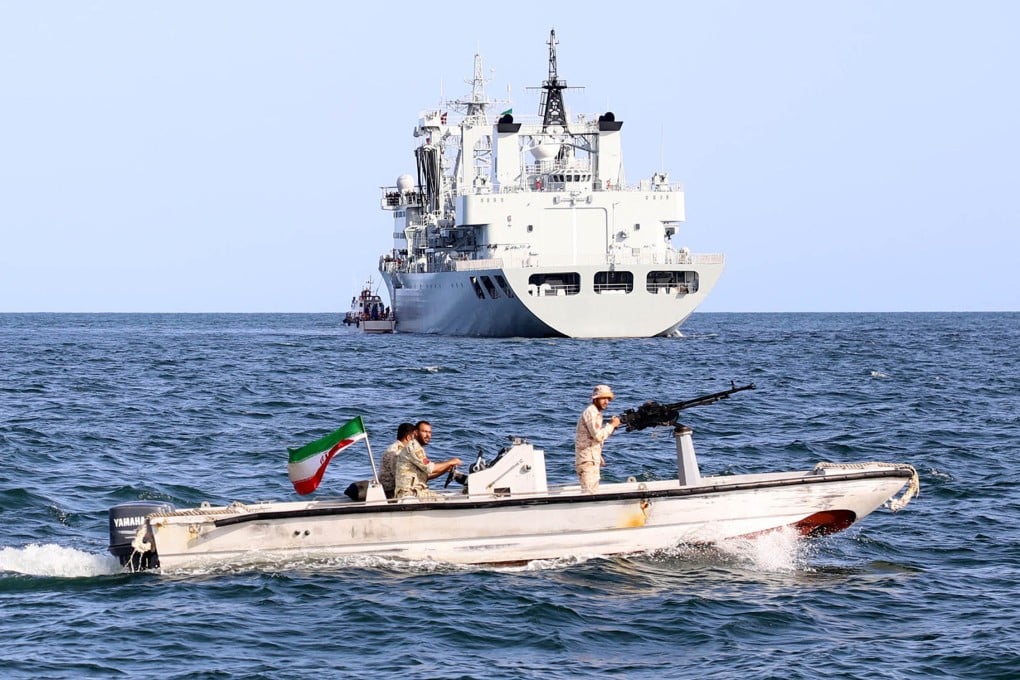 This handout picture, provided by the Iranian Defence Ministry on March 12, 2024, shows Iranian forces piloting a speedboat near a Chinese naval ship during the “Maritime Security Belt 2024” joint exercise carried out by Tehran, Moscow and Beijing in the Gulf of Oman. Photo: AFP