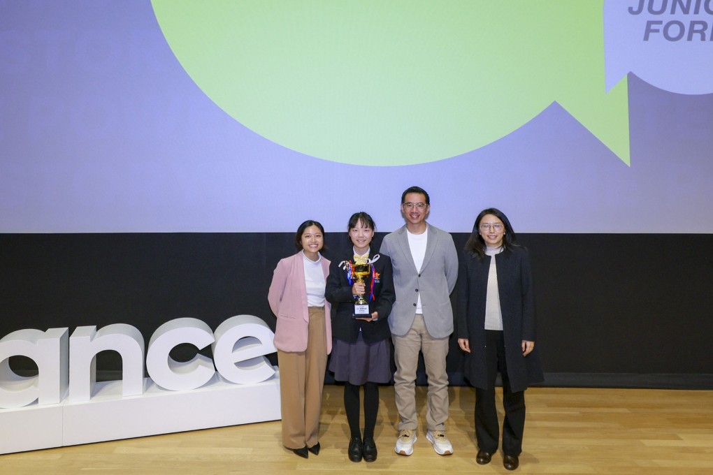 Wan Ruixi (second left) receives her award from judges Esther Cheung (left), deputy editor of SCMP’s Young Post, Spark and Posties, and Gary Lo, storytelling coach and managing director of Glo Consulting. They are joined by the Post’s Ang Jin (right). Photo: SCMP