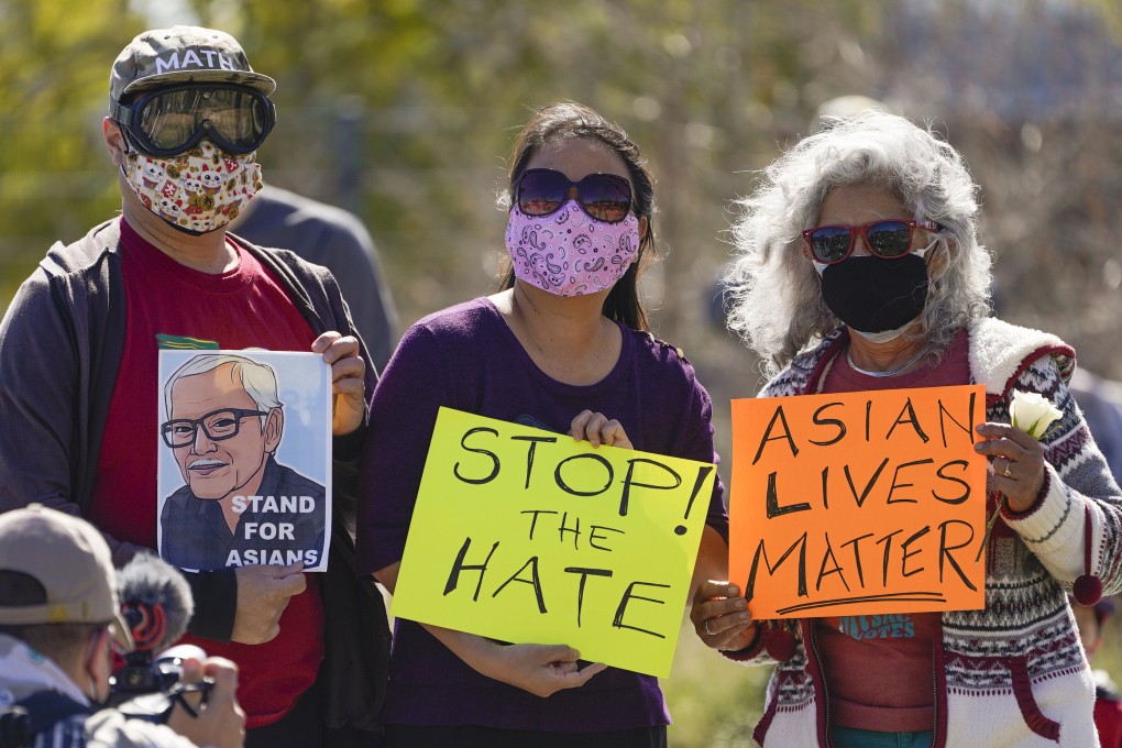 A man holds a portrait of Vichar Ratanapakdee during a rally in Los Angeles in February 2021. Photo: AP