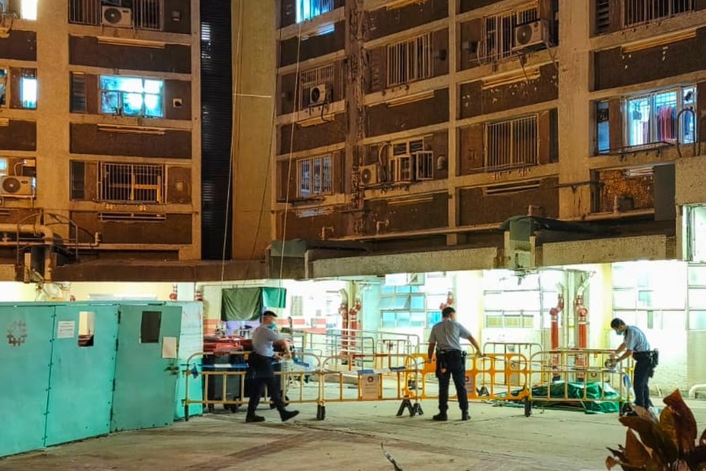 Police officers carry out investigations at Lok Wah South Estate last month following the murder case coming to light. Photo: Handout