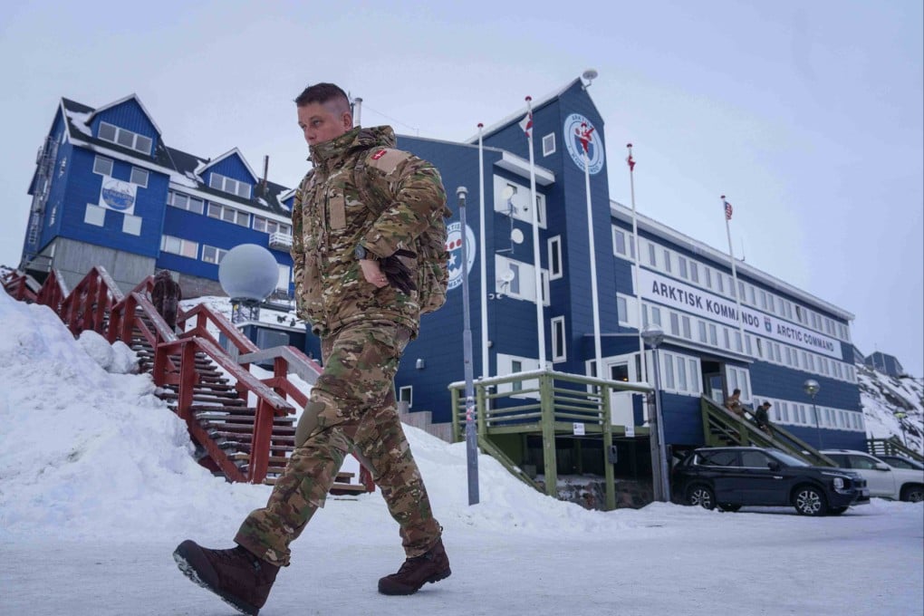 A Danish serviceman walks in front of Joint Arctic Command centre in Nuuk, Greenland, on Friday. Photo: AP