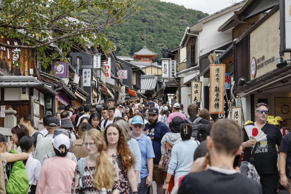 Foreign tourists pack Kiyomizuzaka in Kyoto. Japan has seen a surge in tourist arrivals in recent years. Photo: Kyodo
