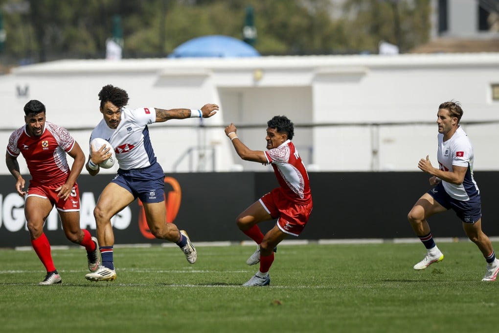 Max Denmark wriggles free of attention during Hong Kong’s victory over Tonga. Photo: World Rugby