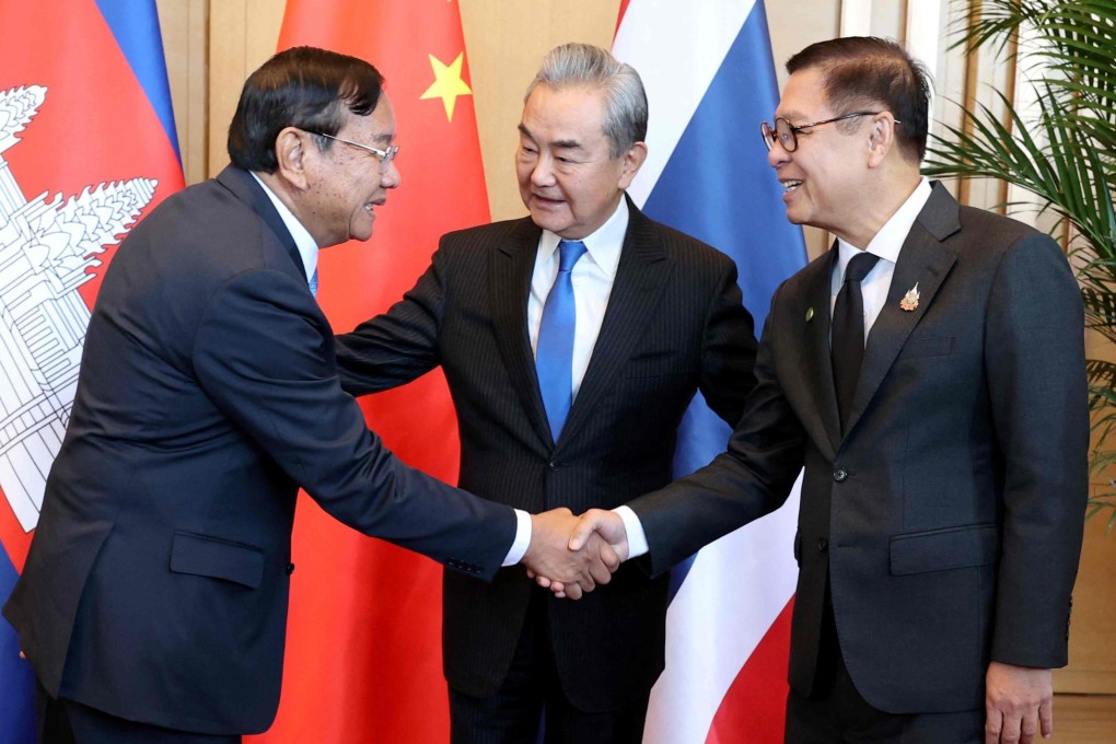 China’s Foreign Minister Wang Yi (centre) looks on as Thailand’s Foreign Minister Sihasak Phuangketkeow (right) shakes hands with  Cambodia’s Deputy Prime Minister Prak Sokhonn  during a meeting in China’s Yunnan province on December 29, 2025. Photo: Agence Kampuchea Presse/AFP