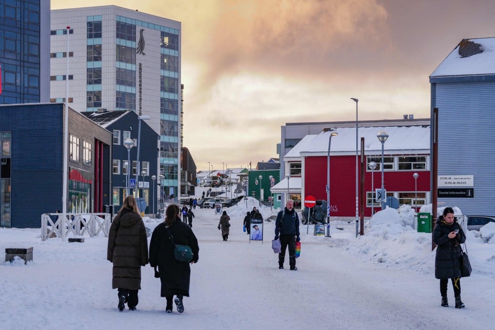 Residents walk along the main shopping street in Nuuk, Greenland, on Thursday. Photo: AFP