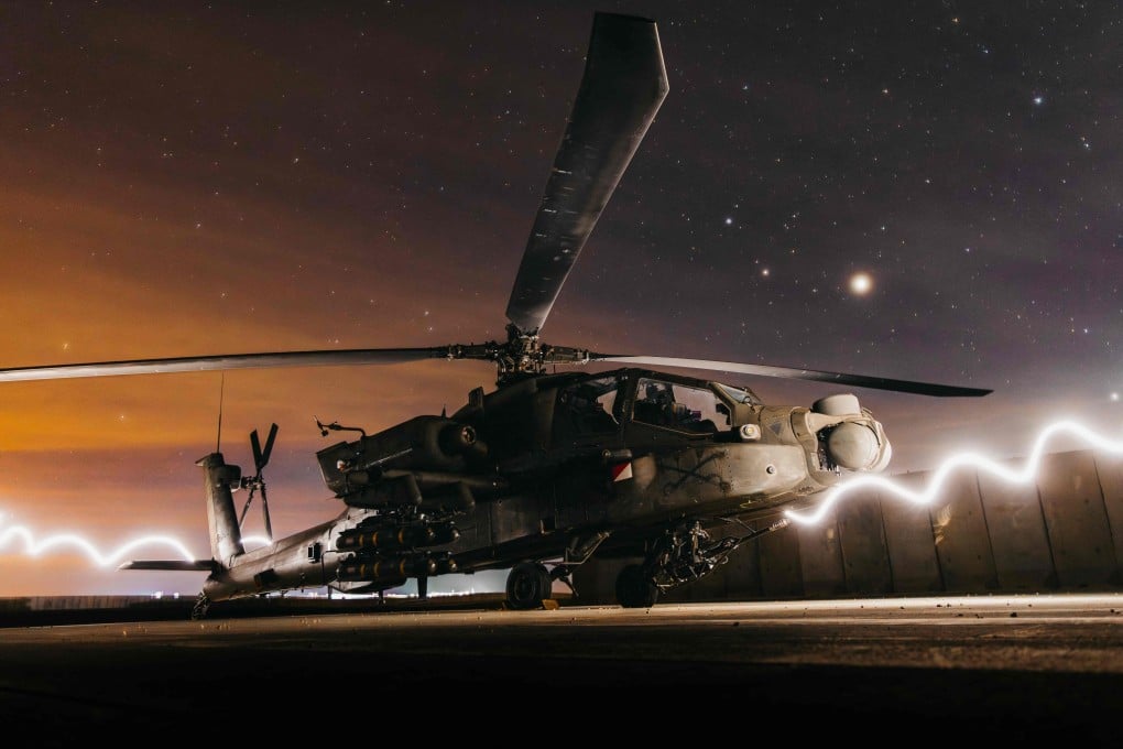 In this US Army photo taken from an undisclosed location in December shows an AH-64 Apache attack helicopter as it prepares to support Operation Hawkeye Strike. Photo: US Air Force via AFP