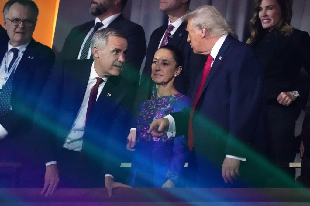 US President Donald Trump speaks to Canadian Prime Minister Mark Carney as Mexican President Claudia Sheinbaum looks on at the end of the draw for the 2026 World Cup at the Kennedy Centre in Washington, on December 5, 2025. Photo: AP