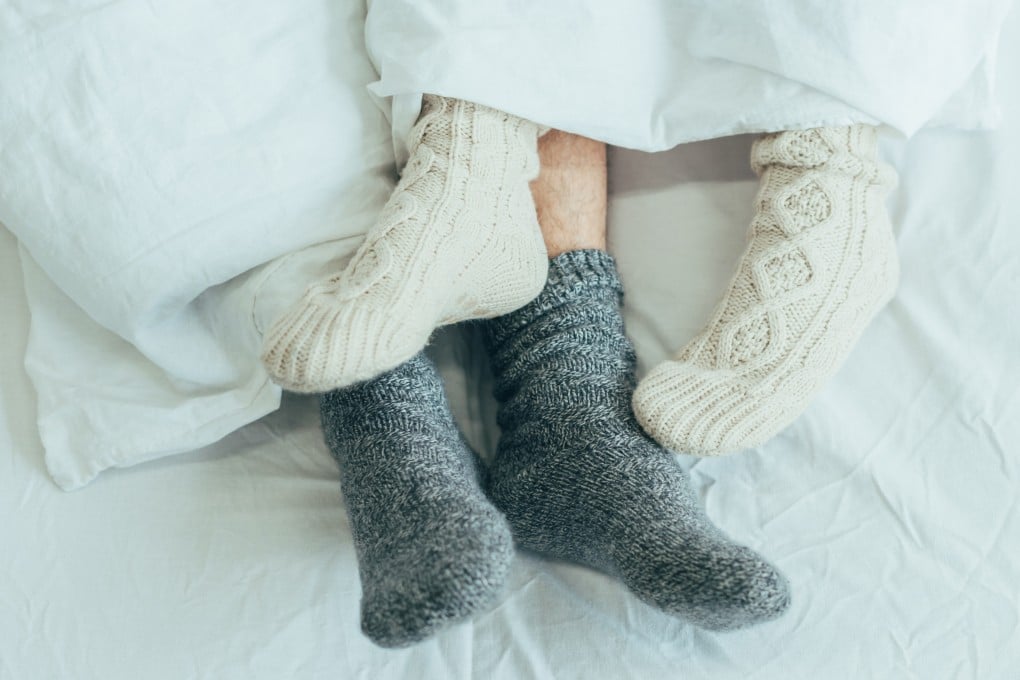 A couple lie in bed. Religious anti-vice officers in Johor caught a divorced couple in a hotel room together. Photo: Shutterstock