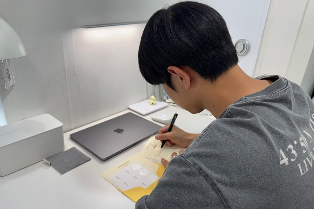 In a society shaped by constant availability, hands-on hobbies like writing letters and scrapbooking require focus and patience - things that more people are looking for as they seek to get away from their phones. Photo: Lee Seung-ku