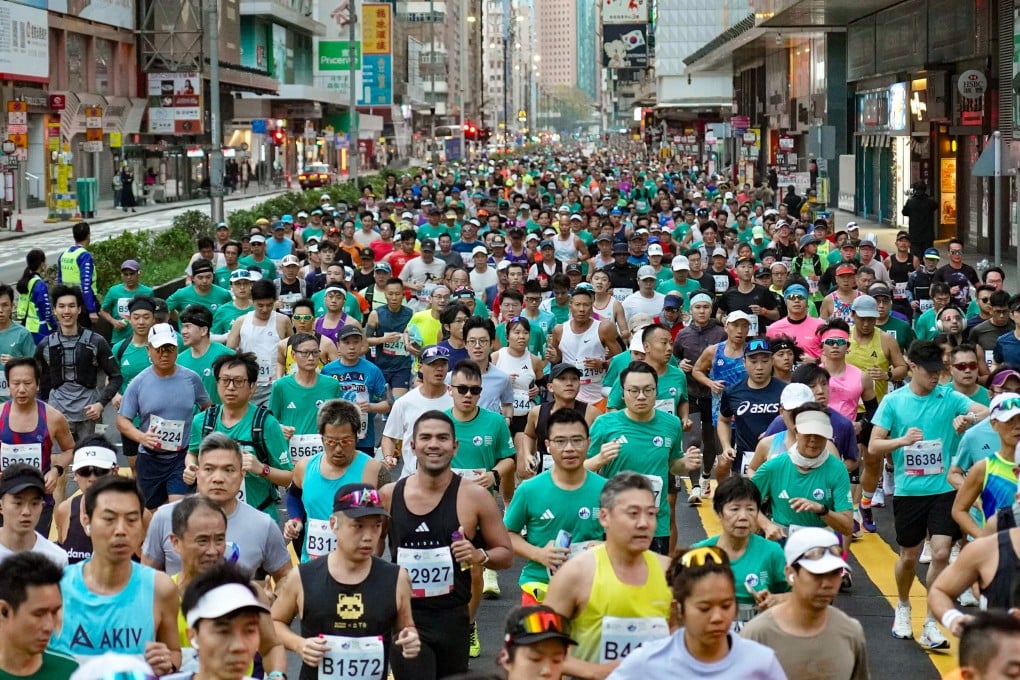 Runners of Standard Chartered Hong Kong Marathon 2026 pass through Mong Kok along Nathan Road. Photo: Karma Lo
