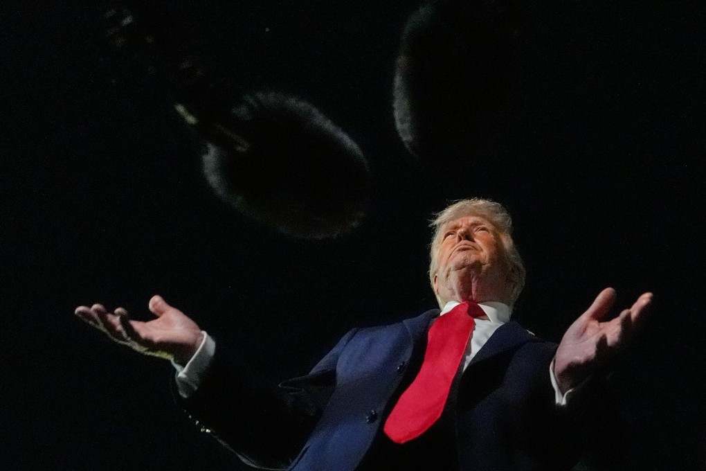 US President Donald Trump speaks to reporters before boarding Air Force One at Palm Beach International Airport, Florida. Photo: AP