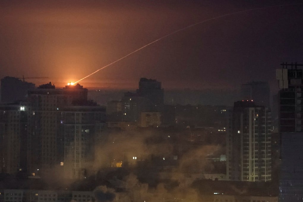 Ukrainian servicemen shoot down a missile during a Russian strike in Kyiv on Tuesday. Photo: Reuters