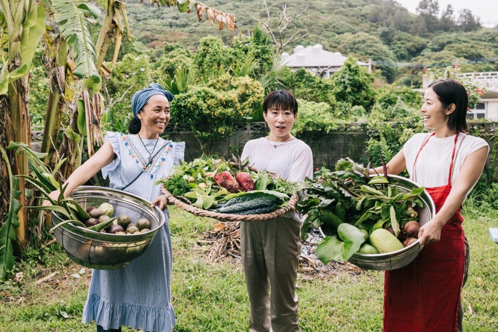 Japanese women in Okinawa show off vegetables freshly picked from their garden. Photo: Getty Images