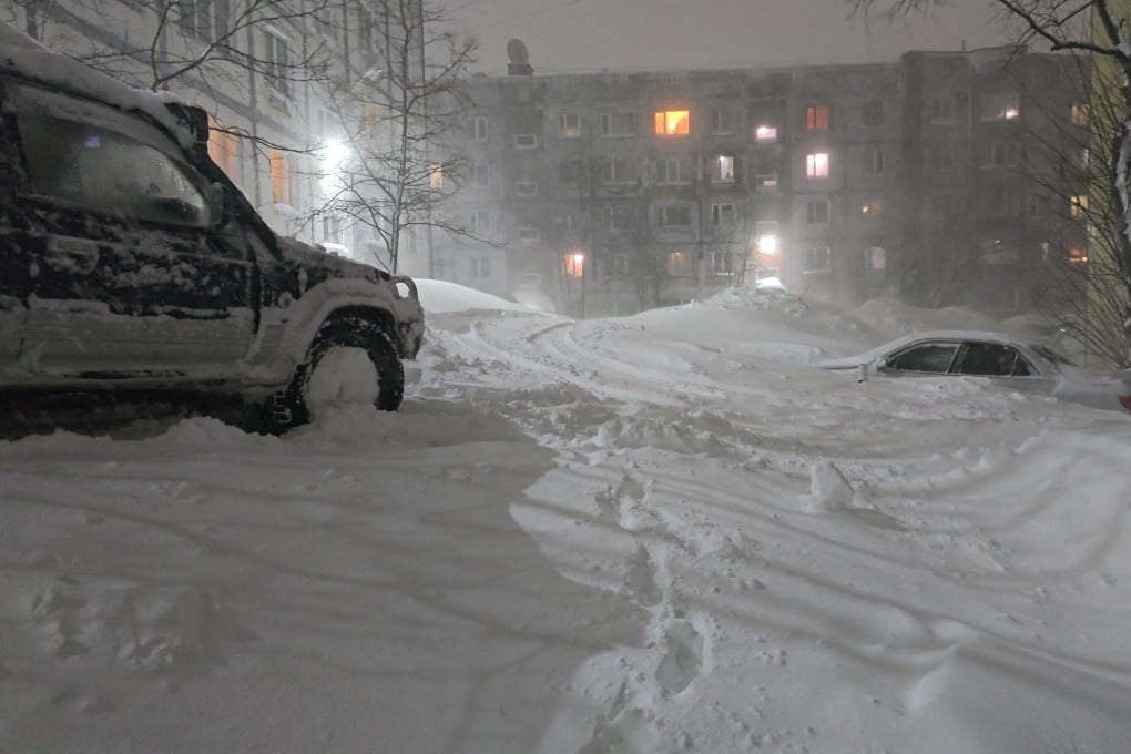 Snow covers cars and the lower floors of residential blocks in the city of Petropavlovsk‑Kamchatskiy, Russia. Photo: Lydmila Moskvicheva via Reuters