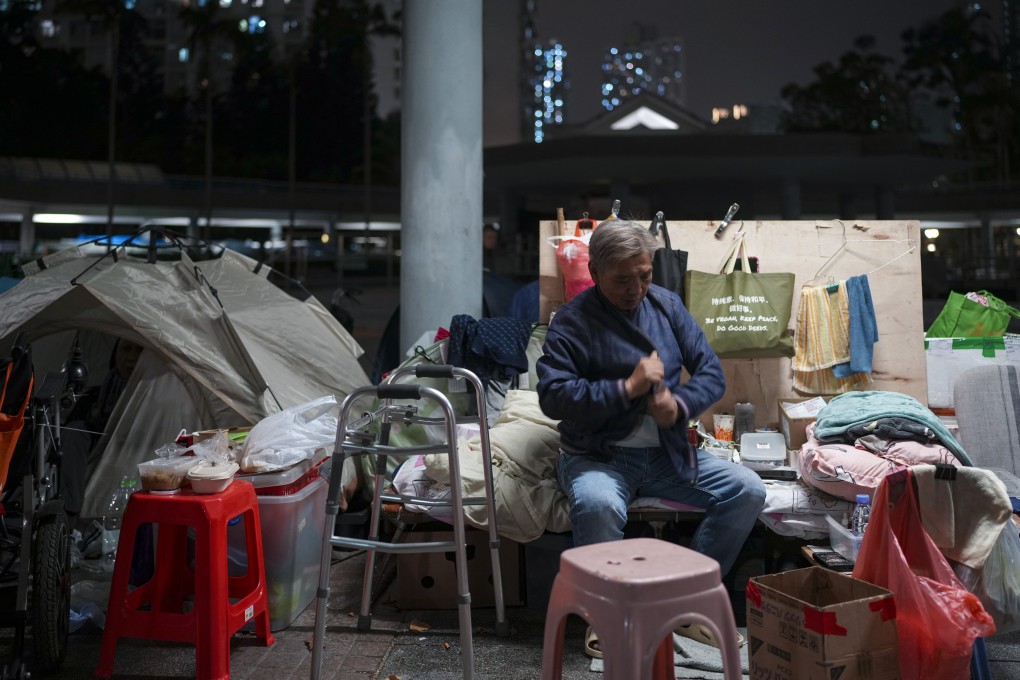 Henry Lai has a wooden board next to his bed to guard against the bitter wind. Photo: Sam Tsang