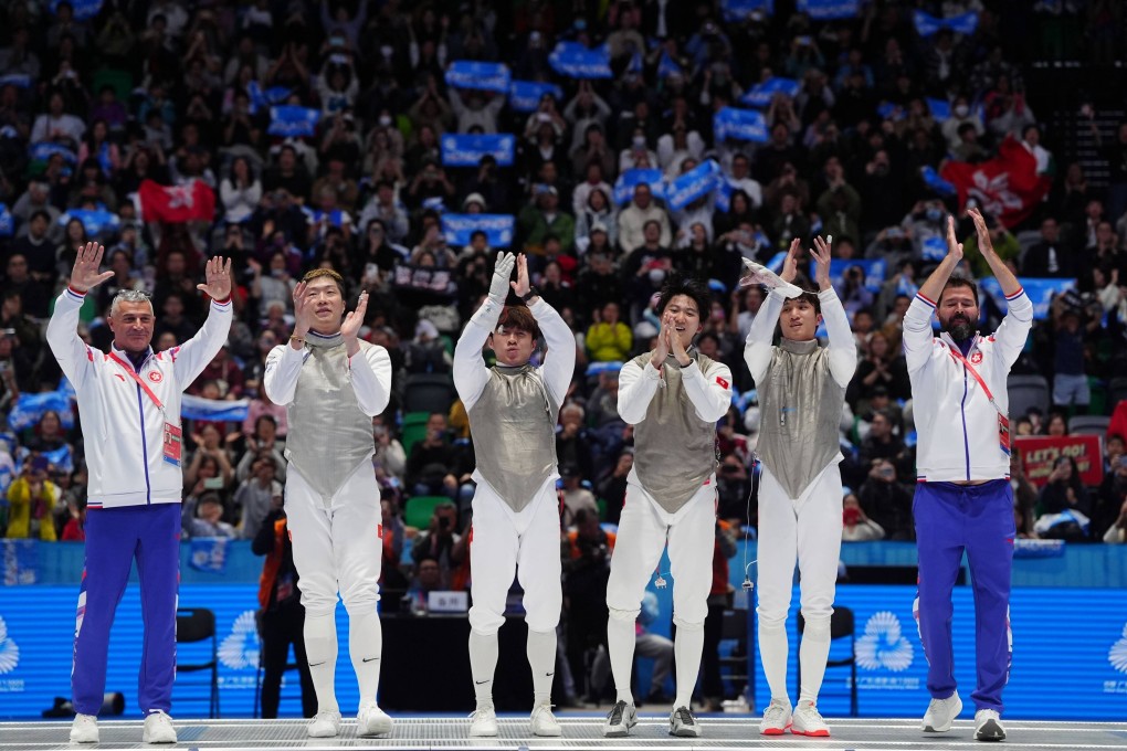 Hong Kong’s men’s foil fencing team (from second left) Cheung Ka-long, Lawrence Ng, Leung Chin-yu and Ryan Choi soak in the applause after winning an historic gold medal at the 15th National Games last November. Photo: Elson Li