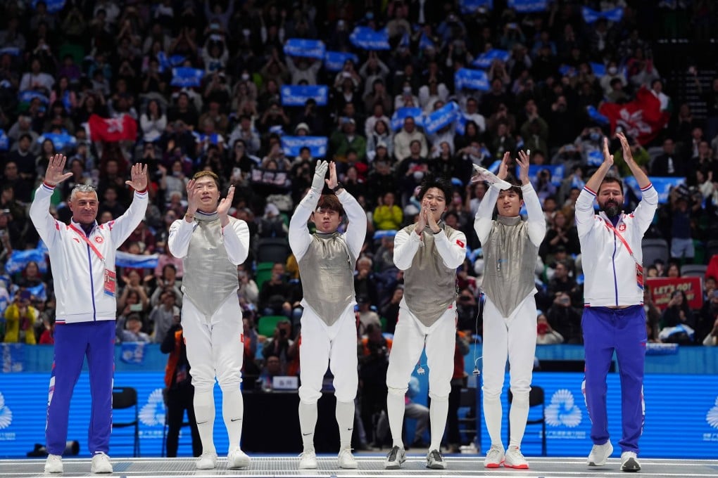Hong Kong’s men’s foil fencing team (from second left) Cheung Ka-long, Lawrence Ng, Leung Chin-yu and Ryan Choi soak in the applause after winning an historic gold medal at the 15th National Games last November. Photo: Elson Li