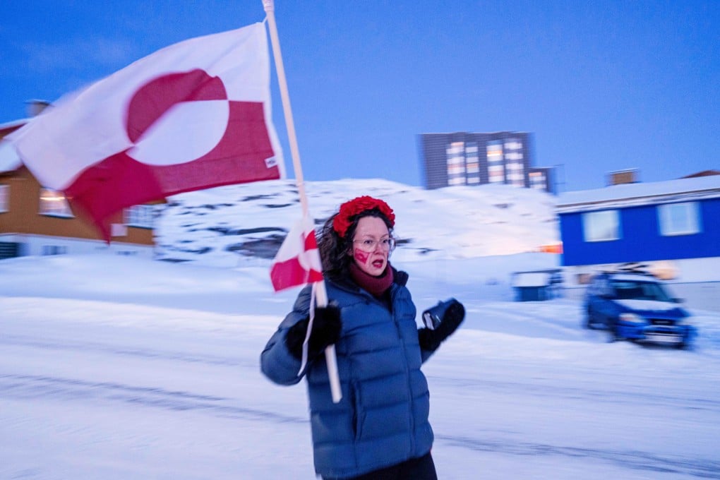 Aviaq Brandt protests against Trump’s policy towards Greenland in front of the US consulate in Nuuk on Tuesday. Photo: AP
