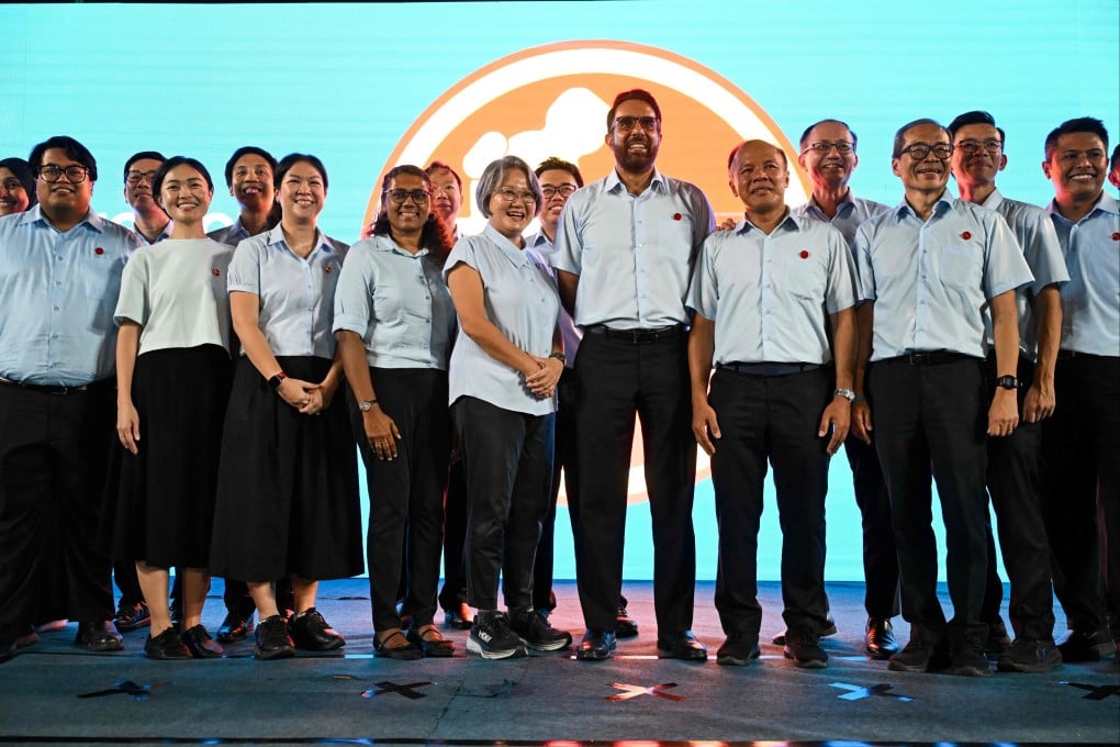 Singapore’s opposition Workers’ Party Secretary General Pritam Singh (centre) with his party’s members at Serangoon Stadium as they wait for the results of the 2025 general election. Photo: AFP