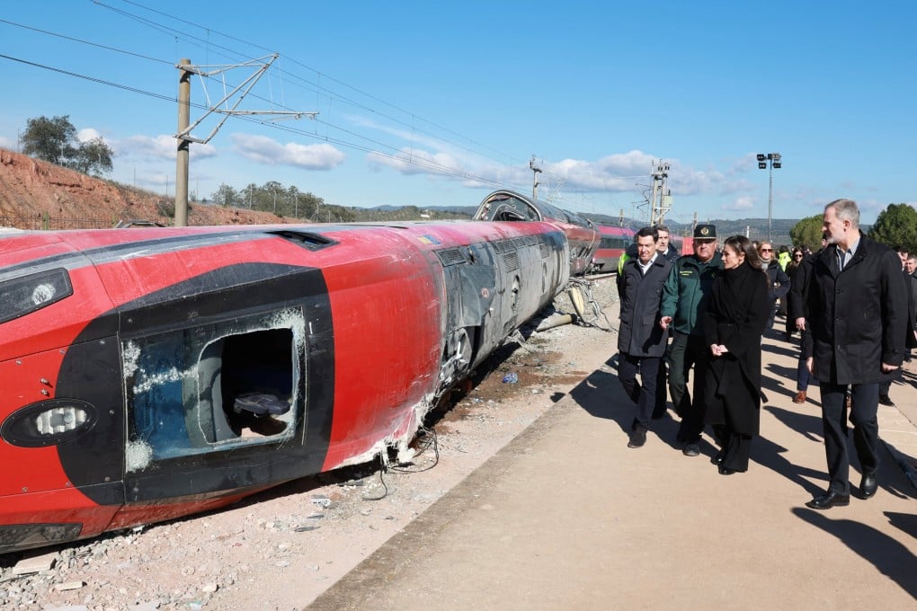 Spain’s King Felipe and Queen Letizia visit the site of the deadly derailment of two high-speed trains near Adamuz, in Cordoba, Spain, on Tuesday. Photo: Reuters