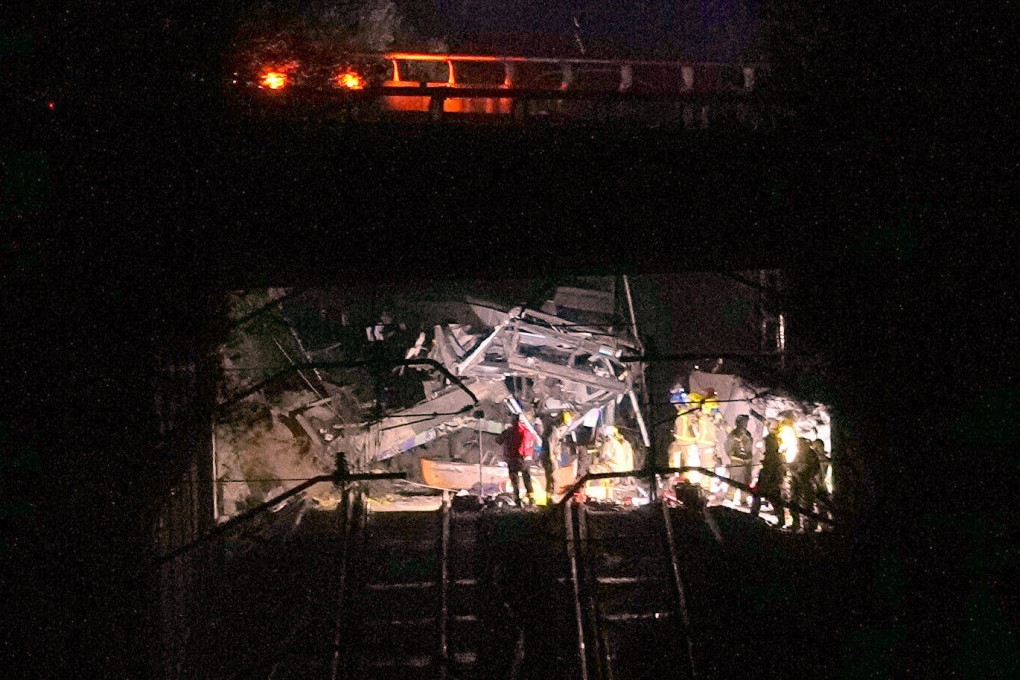 Emergency crews respond after a commuter train derailed near Barcelona, Spain, on Tuesday. Photo: AP