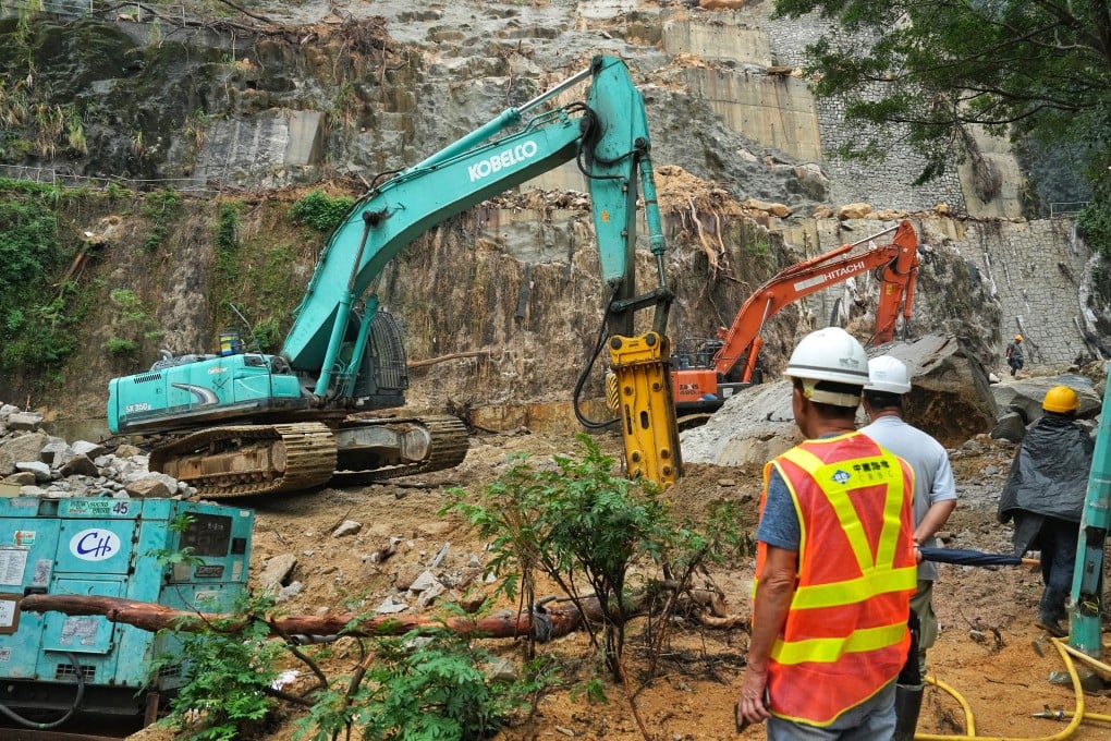 Workers respond to a landslide in Shau Kei Wan, cleaning up mud and boulders on October 19, 2023. Photo: Elson Li