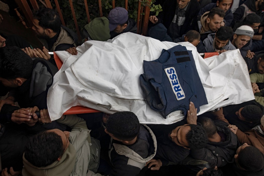 Mourners carry the bodies of three journalists through Nasser Hospital in Khan Yunis, southern Gaza Strip on Wednesday. Photo:  EPA