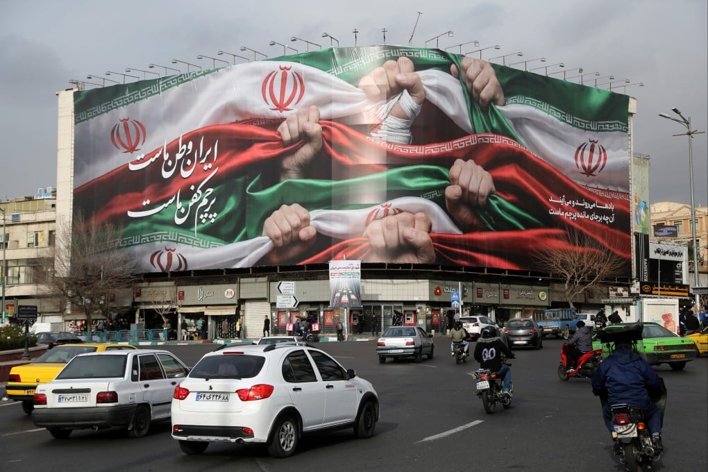 A giant banner hangs over Enghelab Square in central Tehran as Iran faces threats of US intervention following a brutal crackdown on nationwide economic protests. Photo: Xinhua