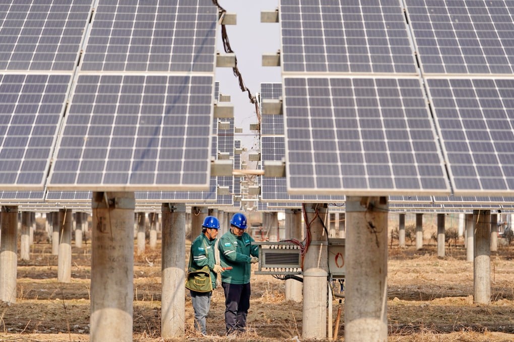 Workers inspect a solar power facility in China’s northern Hebei province. China is ramping up investment in its power grid amid surging demand from the country’s artificial intelligence industry. Photo: Xinhua