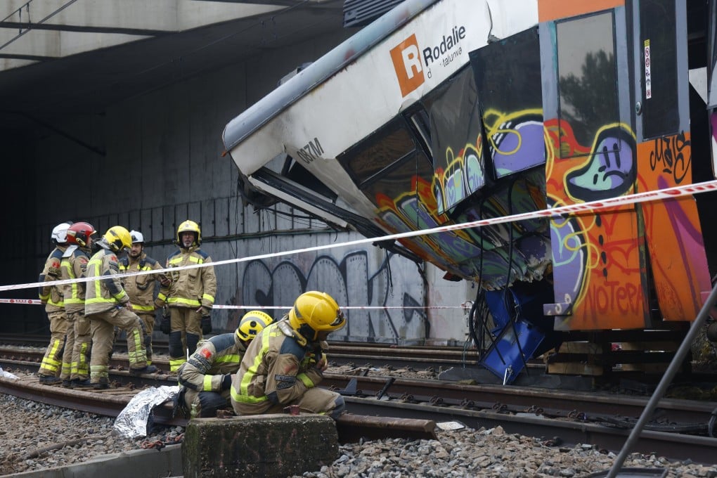 Rescuers on Wednesday inspect a commuter train that derailed near Barcelona, Spain. Photo: EPA