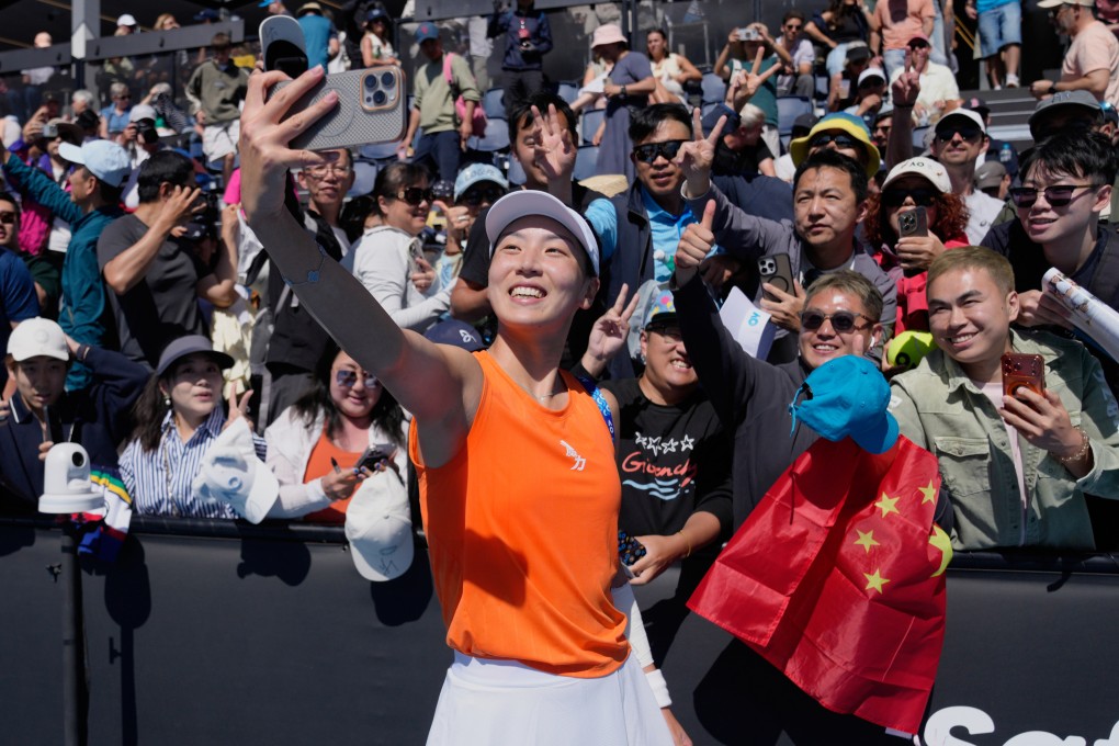 Wang Xinyu takes a selfie with supporters after defeating 24th seed Jelena Ostapenko of Latvia in their second round match on Thursday. Photo: AP