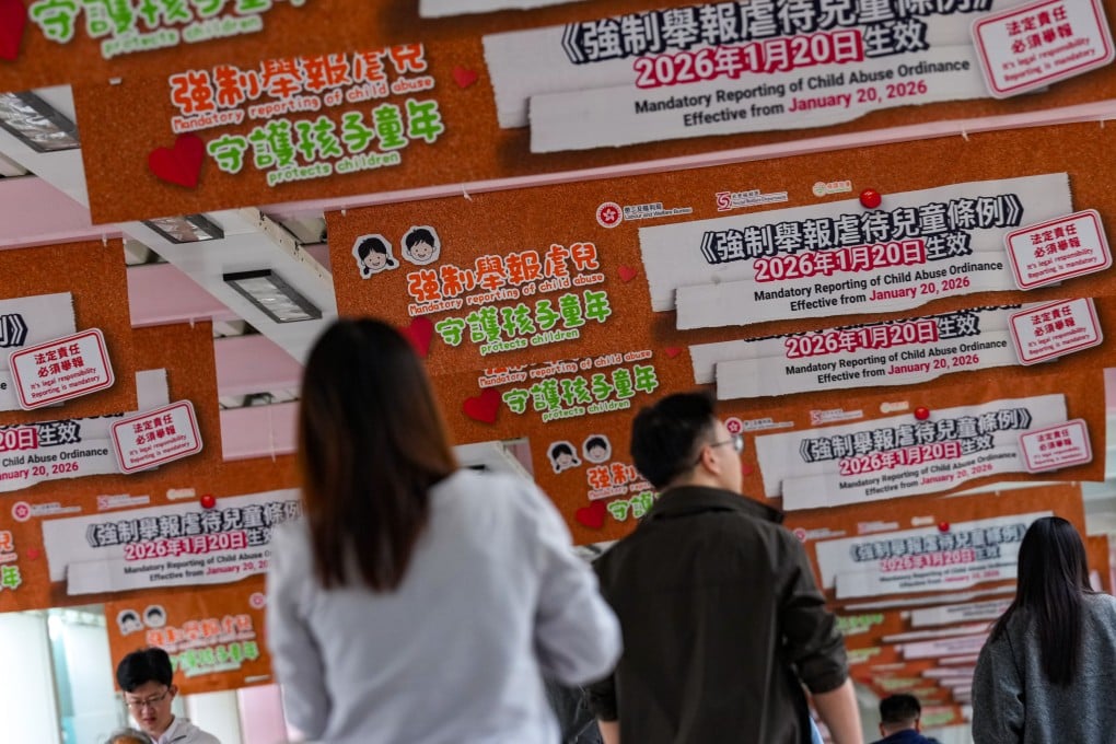 Posters for the Mandatory Reporting of Child Abuse Ordinance along a footbridge in Admiralty on January 20. Photo: Jelly Tse