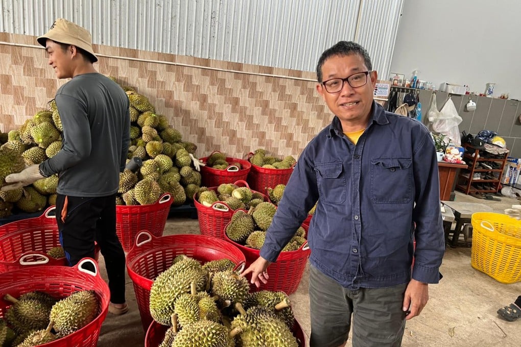 A Vietnamese grower shows off durians from his plantation. Vietnam’s exports of the fruit to China soared by US$500 million in 2025. Photo: Ralph Jennings