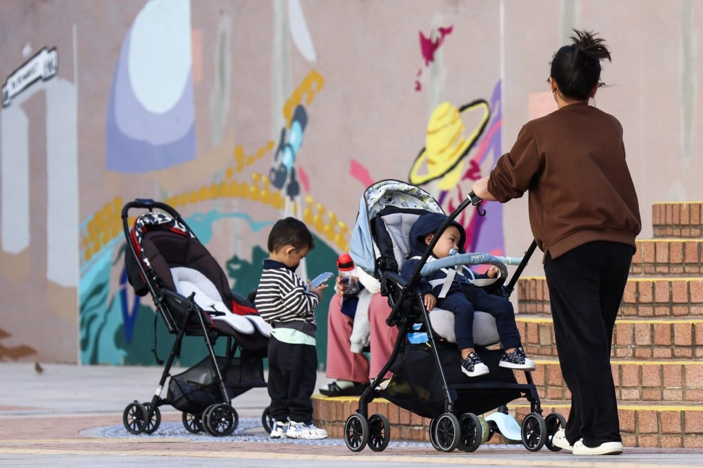 A woman wheels a child in a pram in Tsim Sha Tsui on January 13. Photo: Jelly Tse