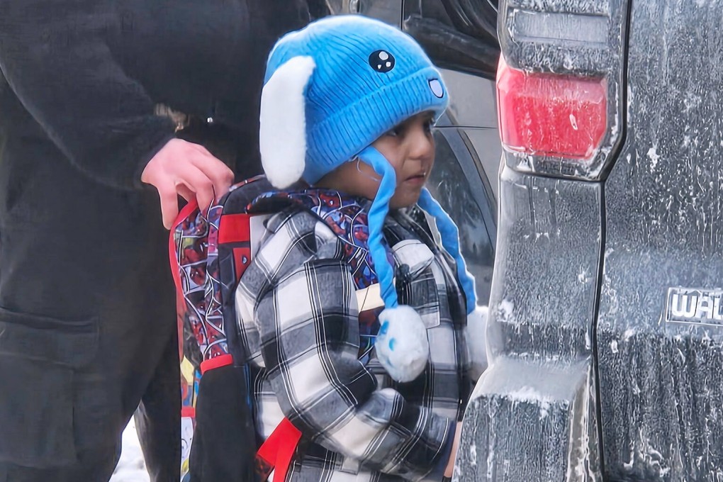 Liam Conejo Ramos, 5, is detained by ICE officers after arriving home from school on Tuesday. Photo: AP