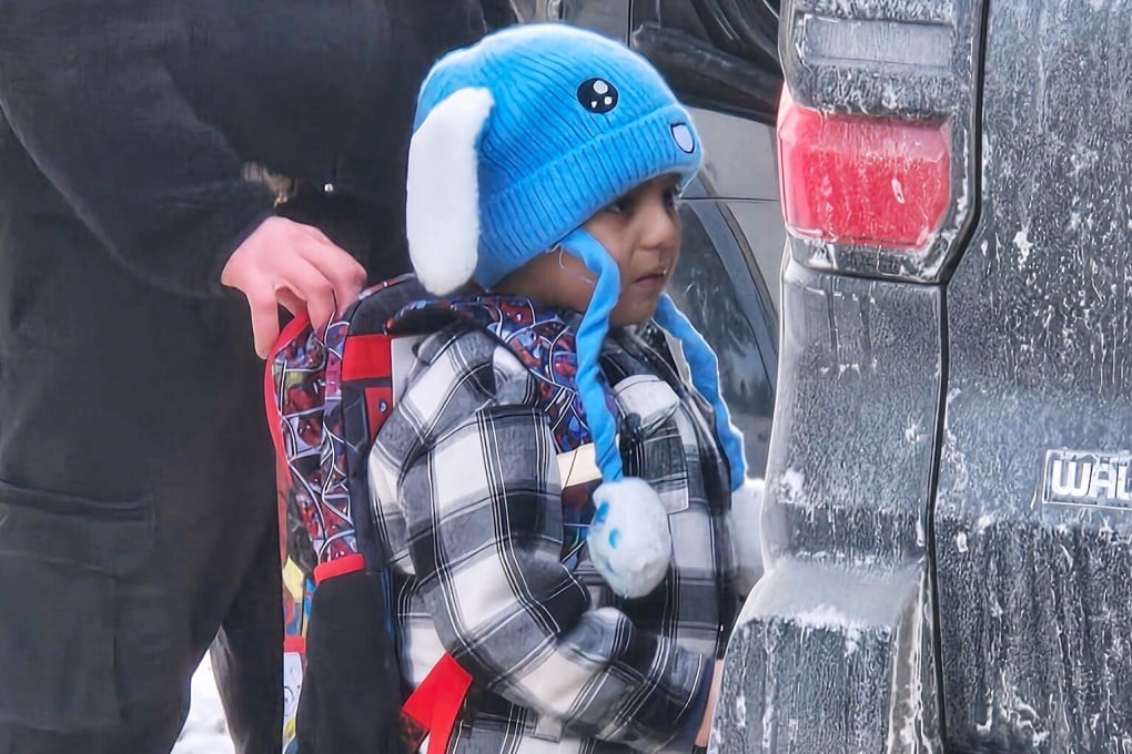 Liam Conejo Ramos, 5, is detained by ICE officers after arriving home from school on Tuesday. Photo: AP