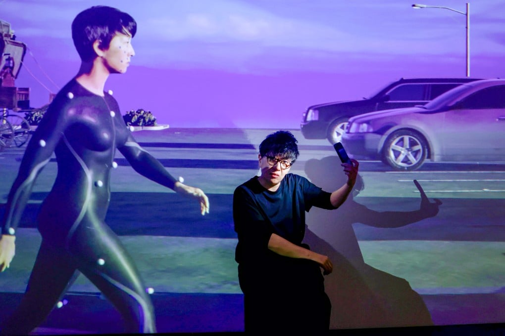 Lau Wai, one of the artists featured in the “Pluriversal Futures” exhibition, with their 2024 artwork The Cast of the Invisible. Photo: Jonathan Wong