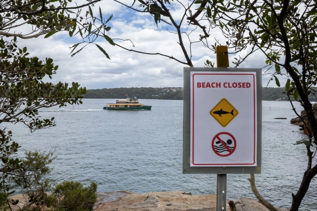 Authorities close a popular rock jumping point near Shark Beach in Vaucluse, Sydney, after a 12-year-old biy is attacked by a shark on Sunday. Photo: EPA