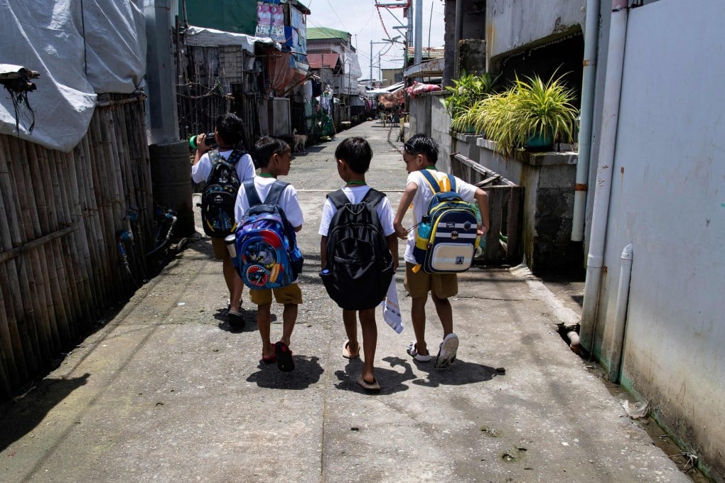 Children walk to school in Bulacan province, north of Manila, in 2025. Photo: AFP