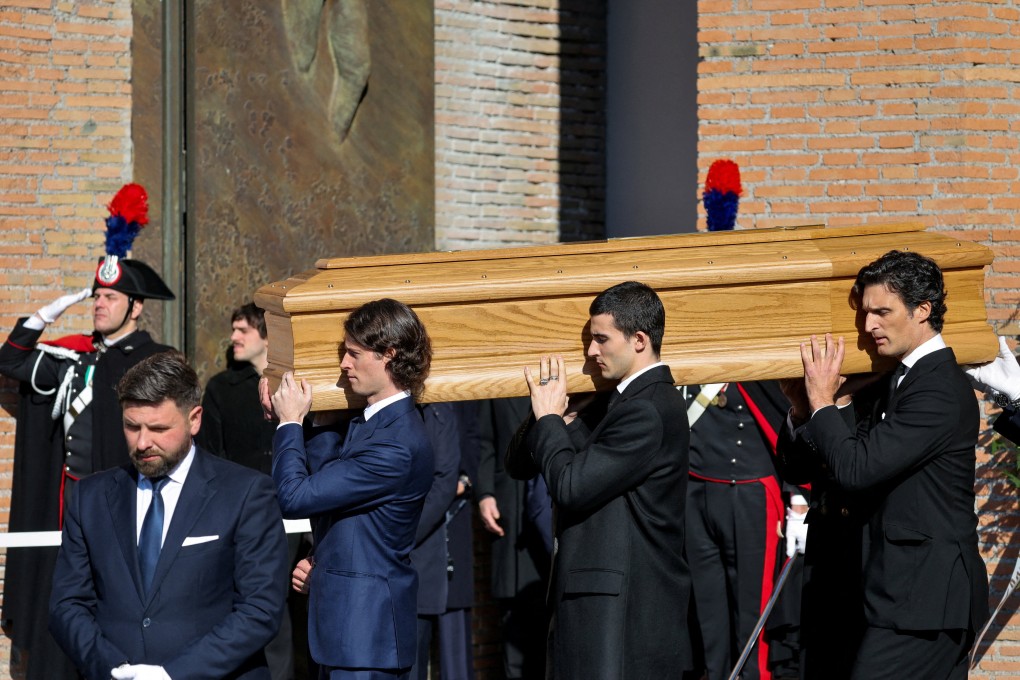 Anthony Souza, the godson of late fashion designer Valentino Garavani, and pallbearers carry the coffin of Valentino Garavani outside the Basilica of Saint Mary of the Angels and Martyrs in Rome on Friday. Photo: Reuters